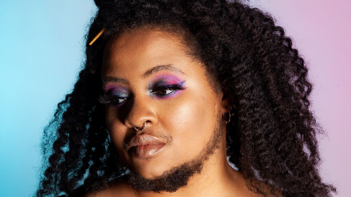 person with makeup and a beard