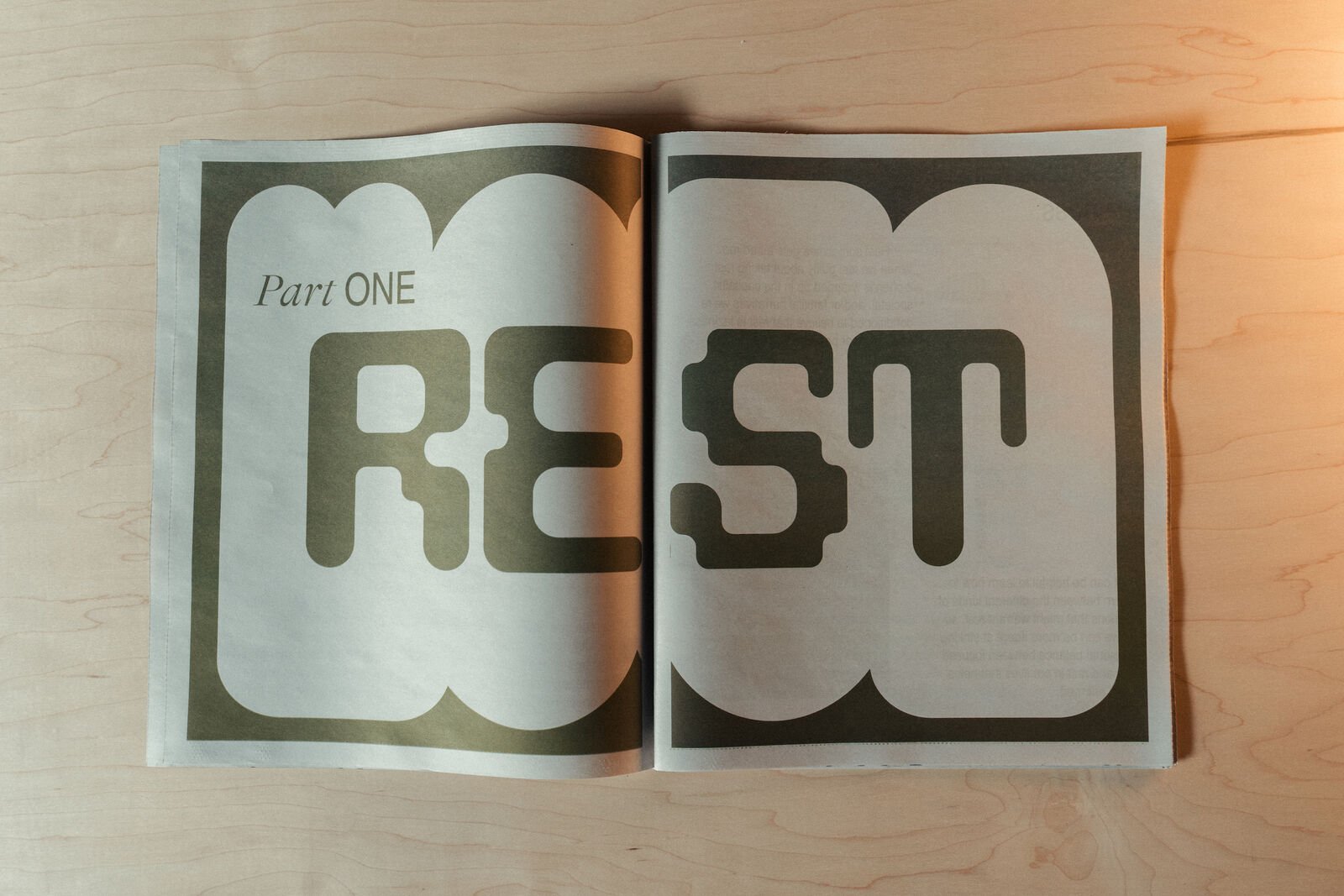 Interior of Supine Horizons resource newsprint. The words Part One, REST can be read.